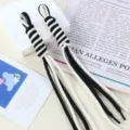 Detailed macro view of black and white braided nylon rope handmade bag charm pendant - 1 Piece / 17# Cream White + Black