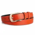 Detail shot of orange leather belt with gold buckle and crystal heart embellishment. - 110cm / Orange
