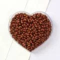Peanut-shaped solid brown acrylic beads for DIY jewelry making in heart-shaped tray - 5x8mm (Approx. 79 Pieces) / Brown
