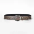 Vintage women's wide brown leather belt featuring intricate floral embossing and silver buckle detail - 110cm / Coffee