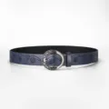 Detail showing floral embossing and vintage silver buckle on a dark blue leather belt - 110cm / Navy Blue