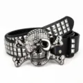 Punk style black leather belt featuring metal pyramid studs and sparkling rhinestone skull buckle. - Black