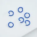 Detail view of vibrant blue painted alloy open jump rings for DIY jewelry craft - 6mm (100pcs) / Dark Blue