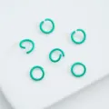 Detailed macro view of teal lacquered alloy open jump rings for DIY jewelry craft projects - 6mm (100pcs) / Turquoise Green