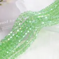Close-up of 4mm AB peridot green crystal bicone glass beads for DIY jewelry making - 4mm Approx 70 Pieces/Strand / Light Green AB