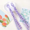 Detailed view of hand-braided purple Roman knot paracord lanyard for phone and keychain DIY - 1 Piece/Pack / Patterned Purple + Light Purple
