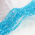 Macro detail of 4mm aqua blue AB crystal bicone glass beads for DIY jewelry making - 4mm Approx 70 Pieces/Strand / Lake Blue AB