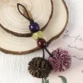 Vintage PU tassel pendant with colorful wooden beads, ideal for handbags and bag charms. - Dark Khaki + Plum Purple