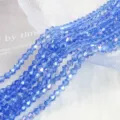 Detail view of 4mm AB blue bicone crystal glass beads for DIY jewelry making crafts - 4mm Approx 70 Pieces/Strand / Light Blue AB
