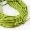 Macro view of 3mm lime green PU leather stitched round core cord for DIY handbag crafts - Approx 2 Meters/Bundle (3mm) / Grass Green