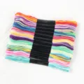 Macro detail view showing a vibrant assortment of multi-strand polyester embroidery floss - 12 Pieces / Space-Dyed Multicolor