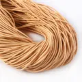 Vista ravvicinata di cordino elastico rotondo 2mm champagne ad alta elasticità - 2m/Fascio-2mm / arancio chiaro