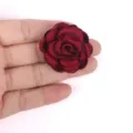 Close-up detail of a dark red fabric rose with burnt edges for DIY accessories - Burgundy