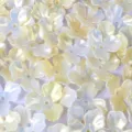 Close-up of pearlescent AB iridescent acrylic magnolia flower petal beads - 10 Pieces/Pack / Creamy Yellow (09)