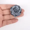 Detailed view of a handmade gray fabric rose flower for DIY crafts and accessories - Grey Blue