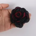 Detailed view of a 7.5cm black and burgundy chiffon burnt edge rose for DIY craft projects - Black