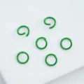 Close-up of green painted alloy open jump rings for DIY jewelry making crafts. - 6mm (100pcs) / Bright Green