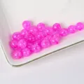Detailed view of vibrant pink crackled glass beads, perfect for DIY bracelets and jewelry making. - Rose Red
