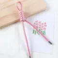 Close-up detail of 5mm pearlescent PU braided cord bag charm and phone hanging strap. - 1 Piece / Pearlescent Pink