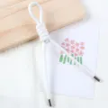 Detail view of 5mm white pearlescent PU leather cord, core rope for DIY handmade bag charms. - 1 Piece / White