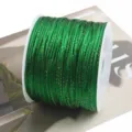 Green metallic cord spooled tightly for DIY crafts, Chinese knotting, and handmade jewelry making. - Green