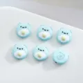Detailed view of 12mm blue fried egg bear alloy beads, perfect for DIY phone chains and bracelets. - Light Blue