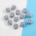 Close-up of metallic silver smiley face acrylic beads for DIY bracelet jewelry making - 20 Pieces Set / Silver (05)