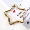 Dettaglio ravvicinato di una chiusura a molla a stella dorata per ferramenta per portachiavi - Star Shape (08# Gold Star)