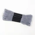 Close-up view of five skeins of premium grey 6-strand polyester embroidery thread - 5 Pcs Set / Gray