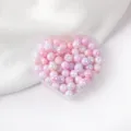 Close-up detail of glossy pink AB acrylic round craft beads inside a heart tray. - Color 07 Style