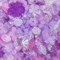 Close-up view of mixed purple acrylic flower and petal beads with AB coating. - Deep Purple Mix (08)