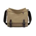 Detailed front view of a khaki canvas messenger bag with brown leather accents and buckles. - Khaki