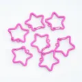 Detail shot of pink star-shaped spring clasps for DIY keychains and jewelry making - Rose Red