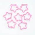 Multiple pink painted star-shaped carabiner clips for DIY jewelry and keychain making - Pink