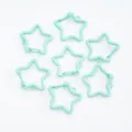 Macro view of mint green star-shaped spring lobster clasps for DIY jewelry crafts. - 1 Piece/Pack / Mint Green