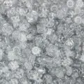 Close-up view of mixed clear acrylic beads, assorted shapes for DIY jewelry making. - 18 Transparent