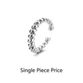 Elegant silver-toned twisted rope ear cuff featuring a delicate Mobius loop design, sold as one piece. - Spiral Ear Cuff (SE1243) / 1PC / Silver