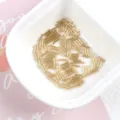 Macro view of 2x7mm gold metallic glass bugle beads for handmade jewelry sewing projects. - 20g/Pack / Light Gold