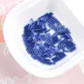 Close-up of 2x7mm blue glass bugle beads for DIY jewelry and garment hand-sewing - 20g/Pack / 16# Royal Blue