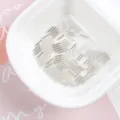 Detailed macro view of 2x7mm silver-lined glass tube beads for DIY jewelry making - 20g/Pack / Silver