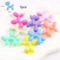 Close-up of colorful resin balloon dog charms with precise size dimensions for DIY - Small Balloon Dog