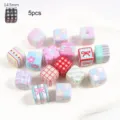 Close-up detail of 14.5mm cute patterned acrylic cube beads for handmade DIY jewelry crafts - Pink Square Painted