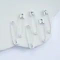 Detailed close-up view of white alloy safety pins, perfect for DIY jewelry and craft accessories. - 31mm (50 Pcs) / White