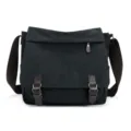 Full front view showing texture of black canvas messenger bag with brown straps and buckles. - Black