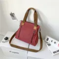 Vintage red canvas tote and crossbody bag for women featuring spacious multi-layer storage - Red