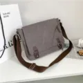 Vintage gray canvas messenger bag with brown adjustable straps for men's casual wear - Gray