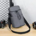 Premium grey multi-compartment water bottle crossbody bag for travel and fitness - Gray