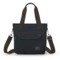 Casual black canvas tote messenger bag with brown straps and front pocket detail - Black