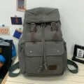 Vintage grey canvas drawstring backpack with faux leather straps and front pocket - Gray
