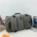 Large grey canvas travel duffle bag with multi-compartments and sturdy reinforced handles - Gray